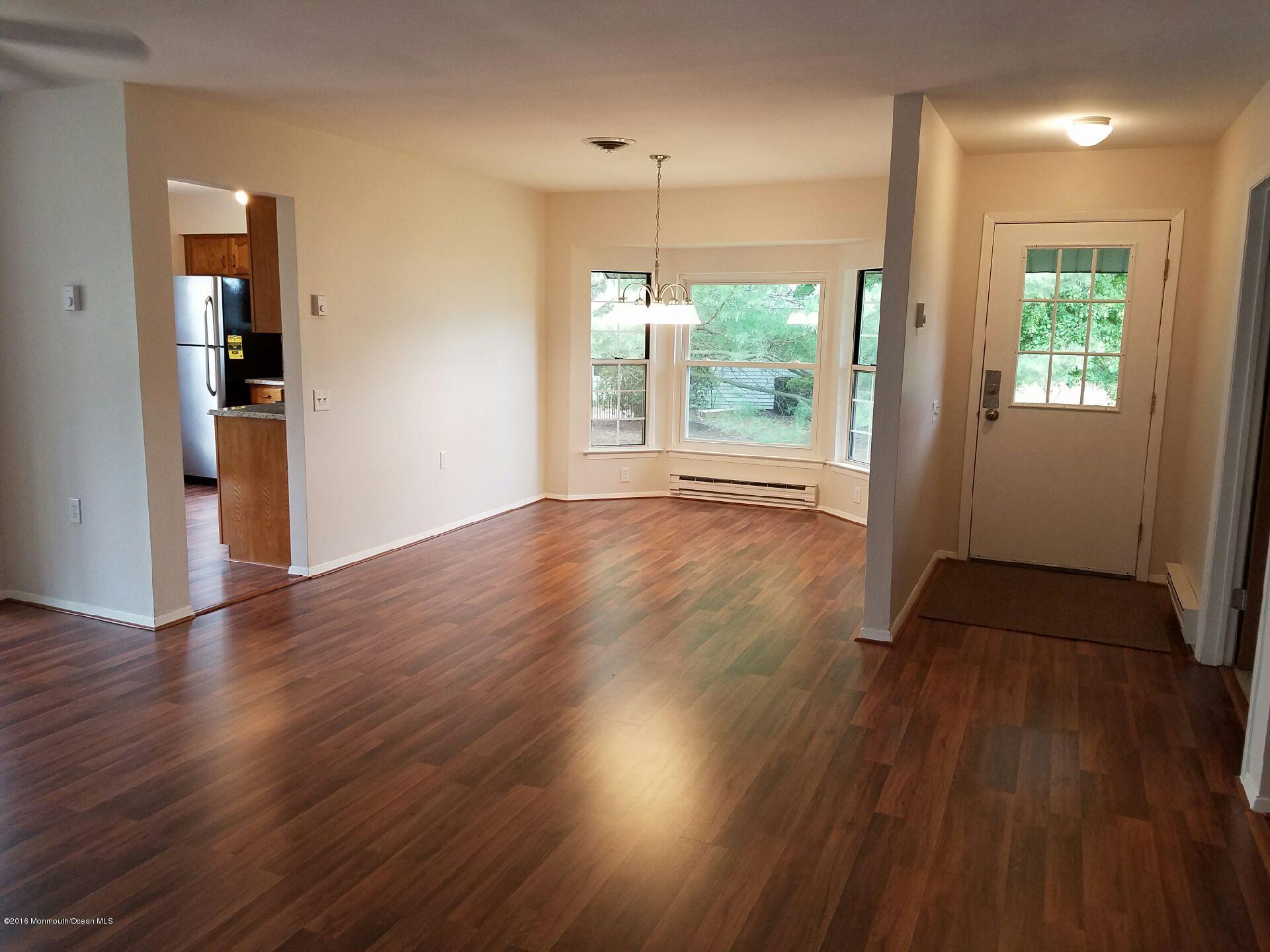 12B Alpine Road, Unit B Whiting, NJ 08759 - Photo 3 of 14 an empty room with wooden floor and windows