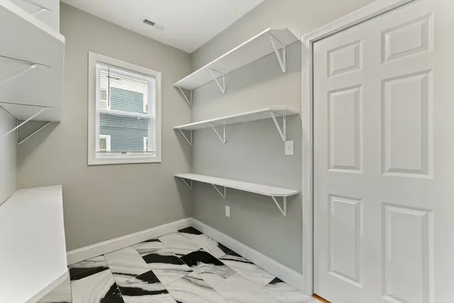 a room that has a bed and a window