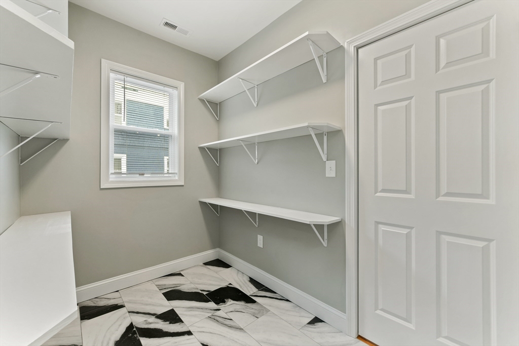 34 Fessenden Street, Unit 2 Boston, MA 02126 - Photo 18 of 21 a room that has a bed and a window