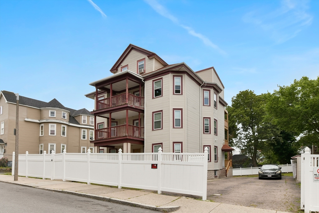 34 Fessenden Street, Unit 2 Boston, MA 02126 - Photo 2 of 21 a view of a white building with large windows