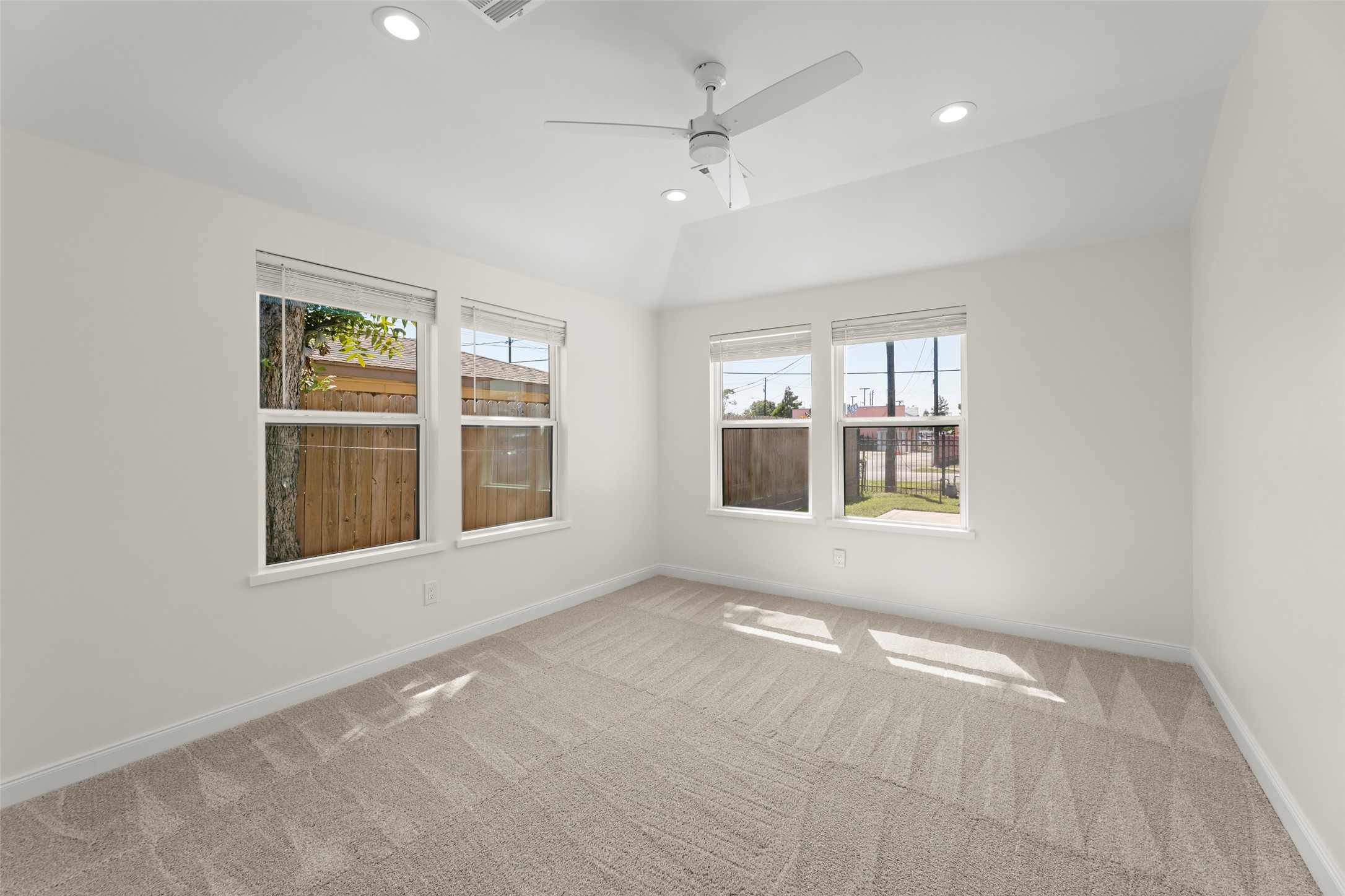 729 Caperton Street Houston, TX 77022 - Photo 14 of 42 an empty room with windows and entrance