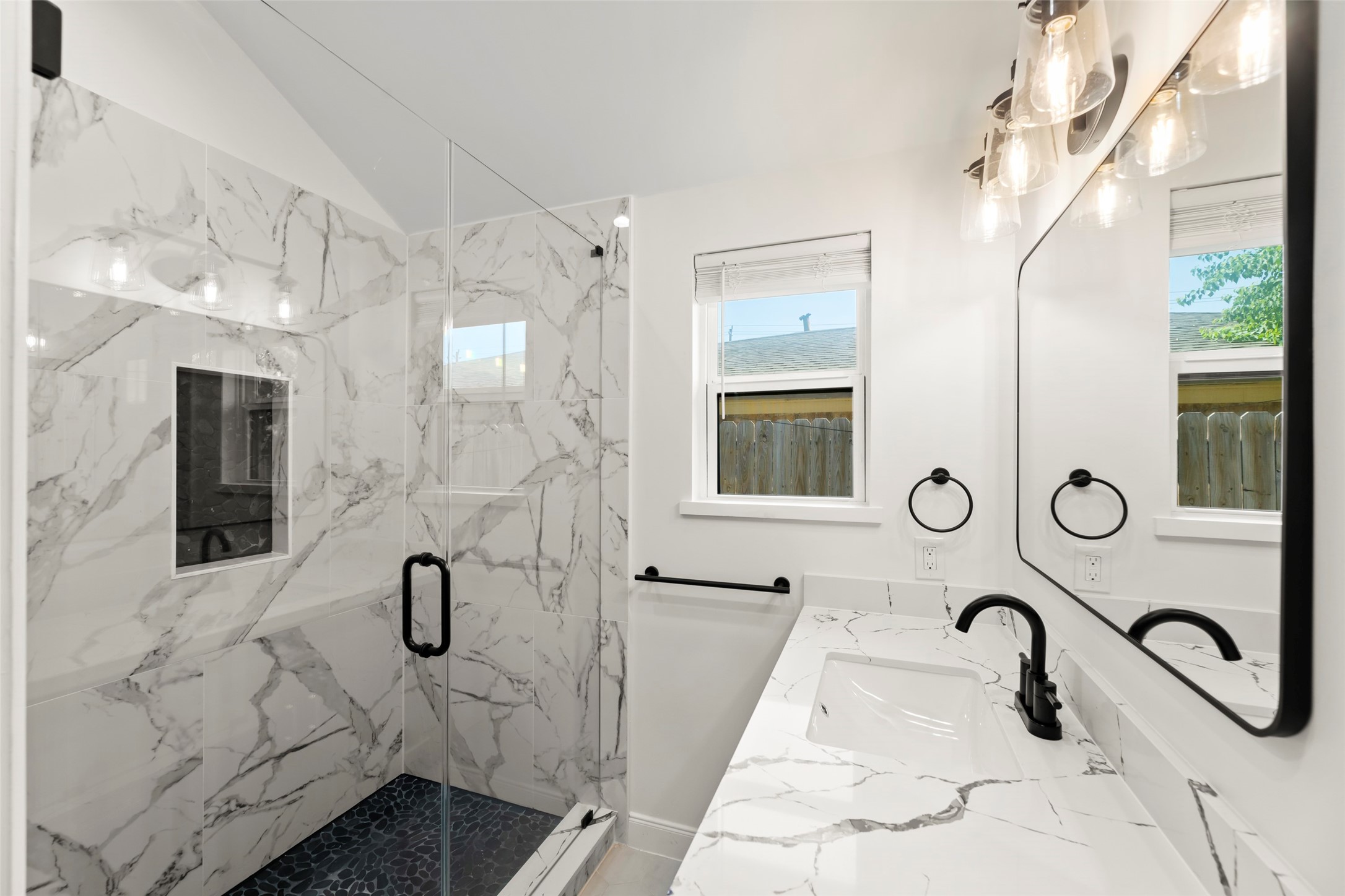 729 Caperton Street Houston, TX 77022 - Photo 16 of 42 a bathroom with a sink and mirror