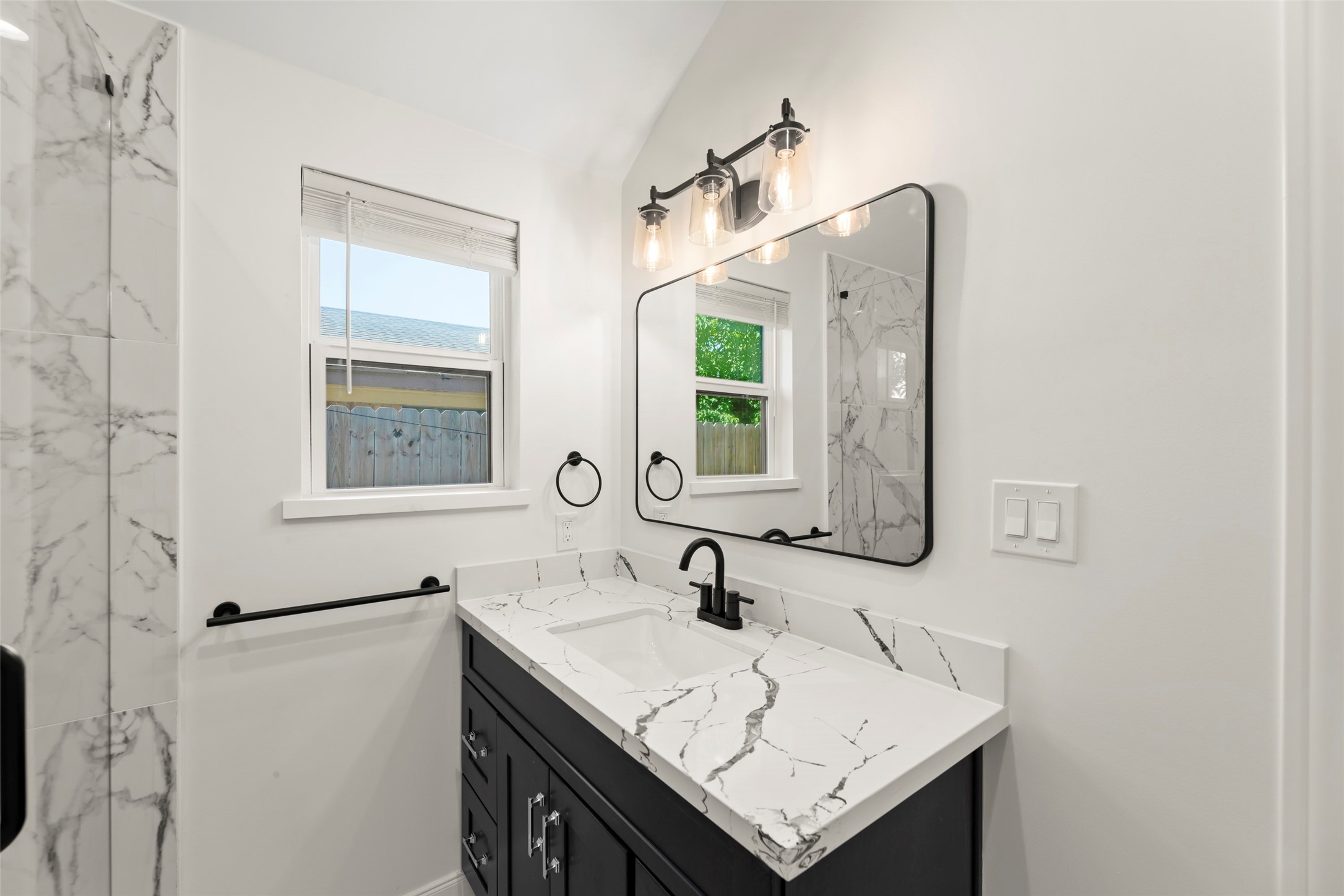 729 Caperton Street Houston, TX 77022 - Photo 17 of 42 a bathroom with a sink and a mirror