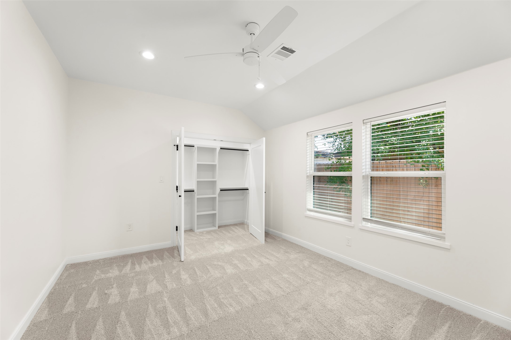 729 Caperton Street Houston, TX 77022 - Photo 19 of 42 a view of empty room with a fireplace and window