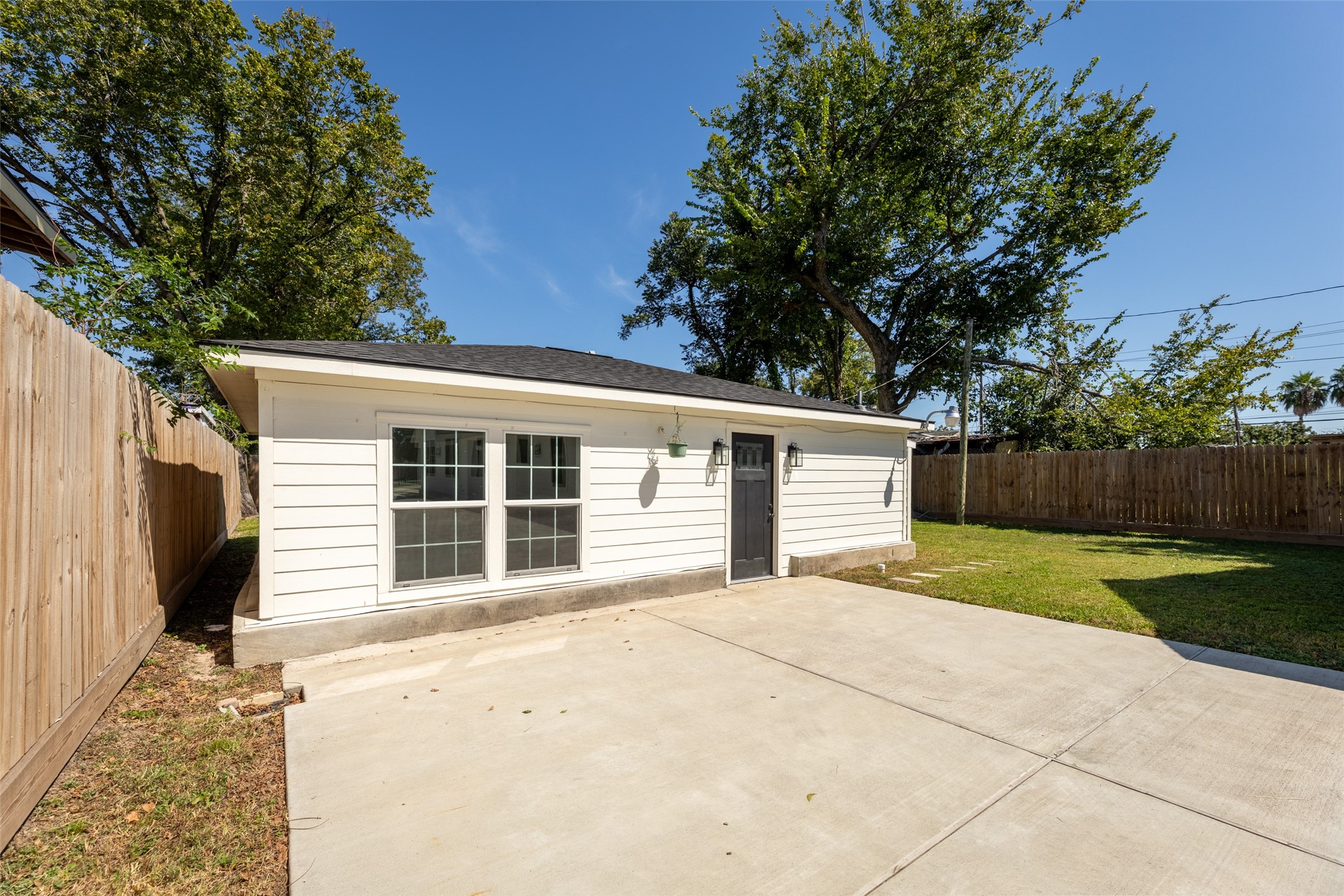 729 Caperton Street Houston, TX 77022 - Photo 27 of 42 a house with trees in the background