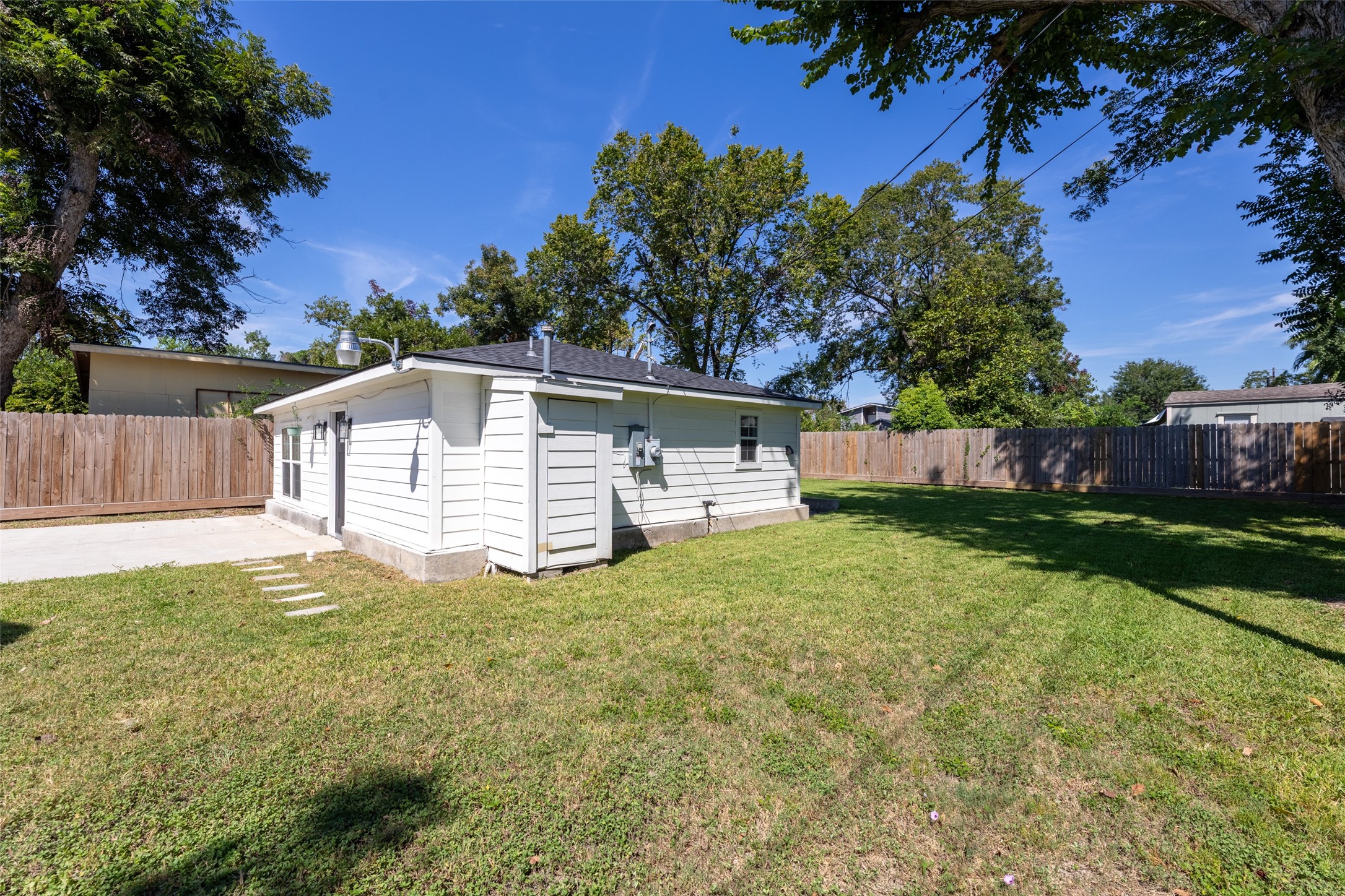 729 Caperton Street Houston, TX 77022 - Photo 28 of 42 a view of a house with backyard and a tree
