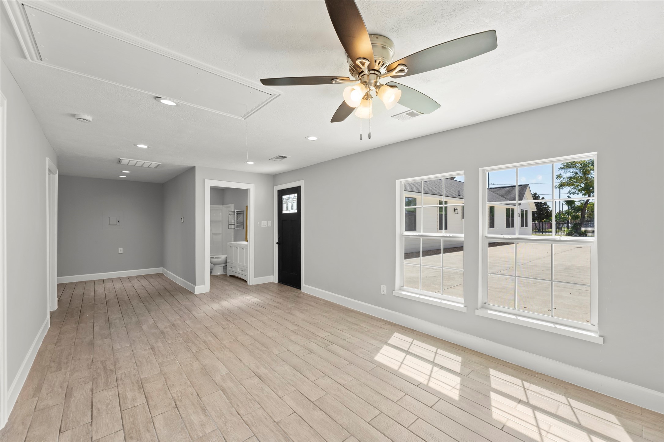729 Caperton Street Houston, TX 77022 - Photo 30 of 42 a view of an empty room with wooden floor and a window