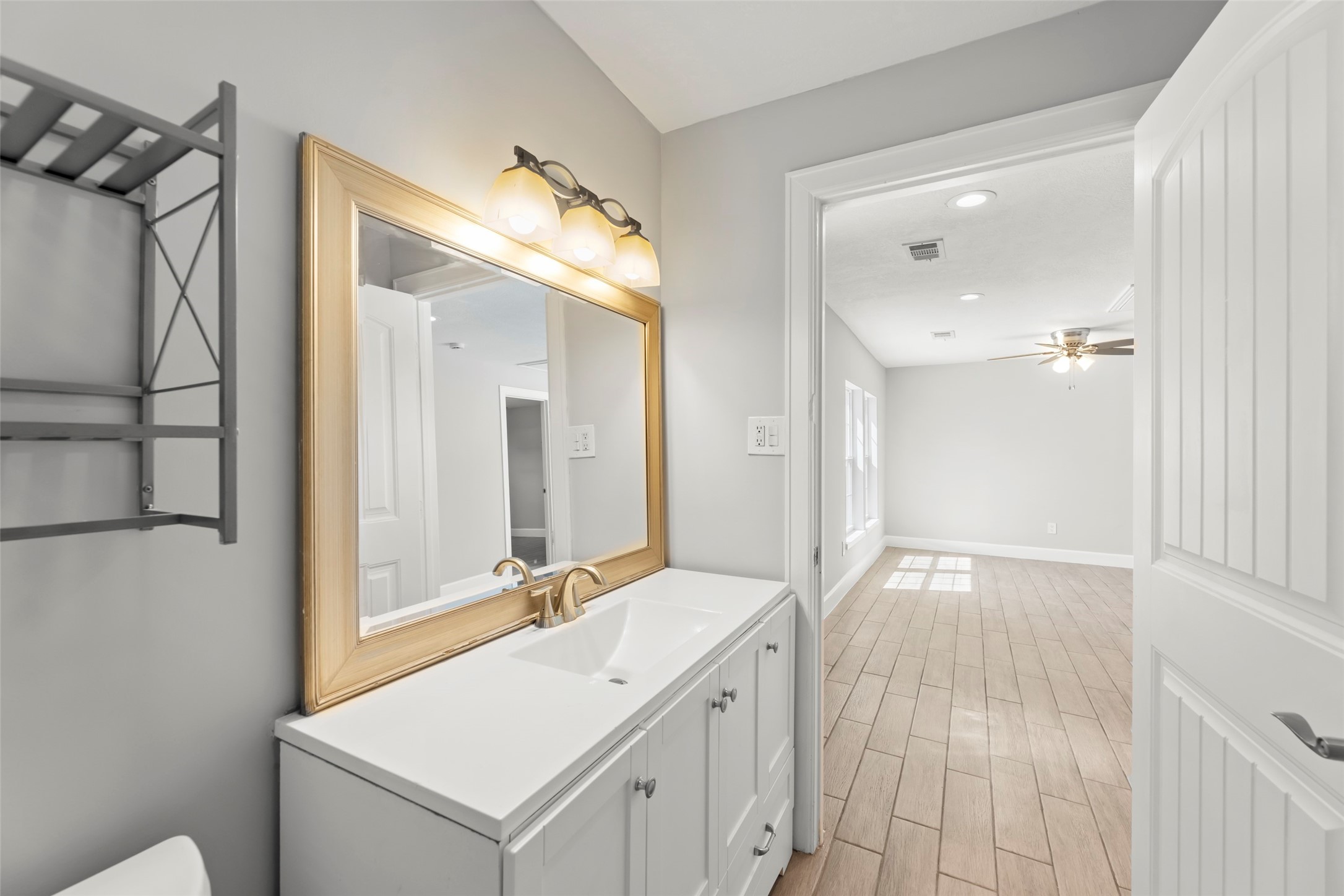 729 Caperton Street Houston, TX 77022 - Photo 34 of 42 a bathroom with a sink and a mirror