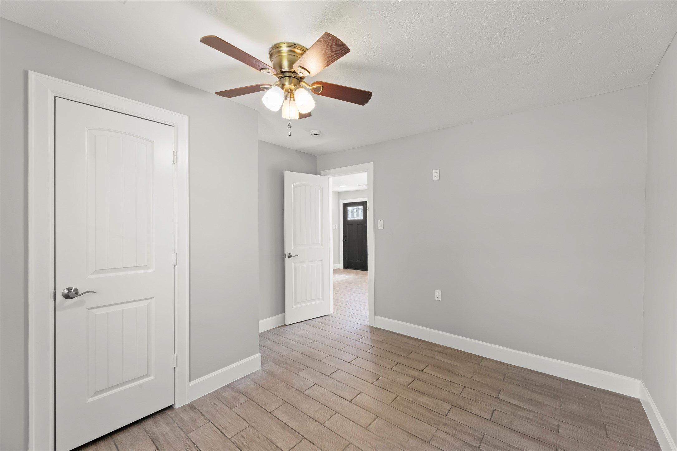 729 Caperton Street Houston, TX 77022 - Photo 38 of 42 a view of an empty room with wooden floor