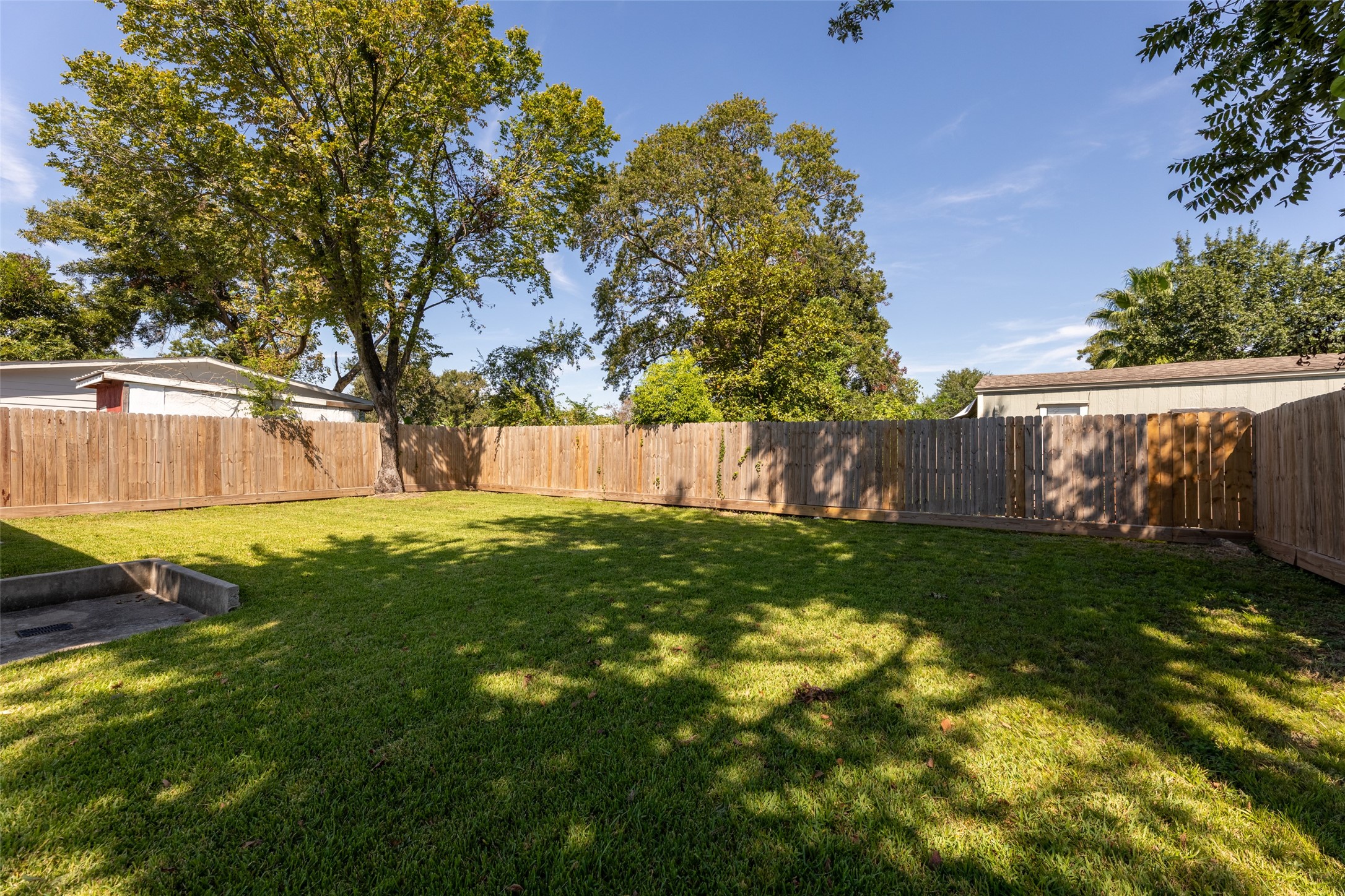 729 Caperton Street Houston, TX 77022 - Photo 41 of 42 a view of backyard with tree