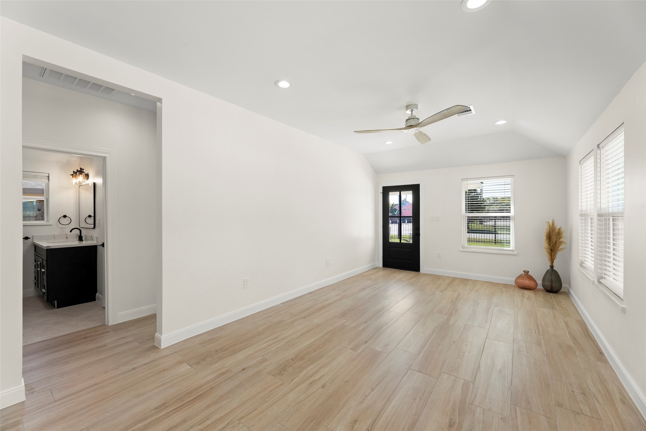 729 Caperton Street Houston, TX 77022 - Photo 9 of 42 wooden floor in an empty room with a window