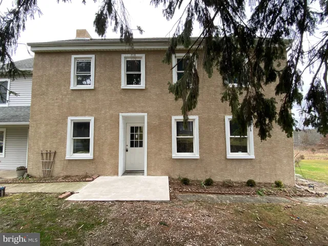 a front view of a house with yard