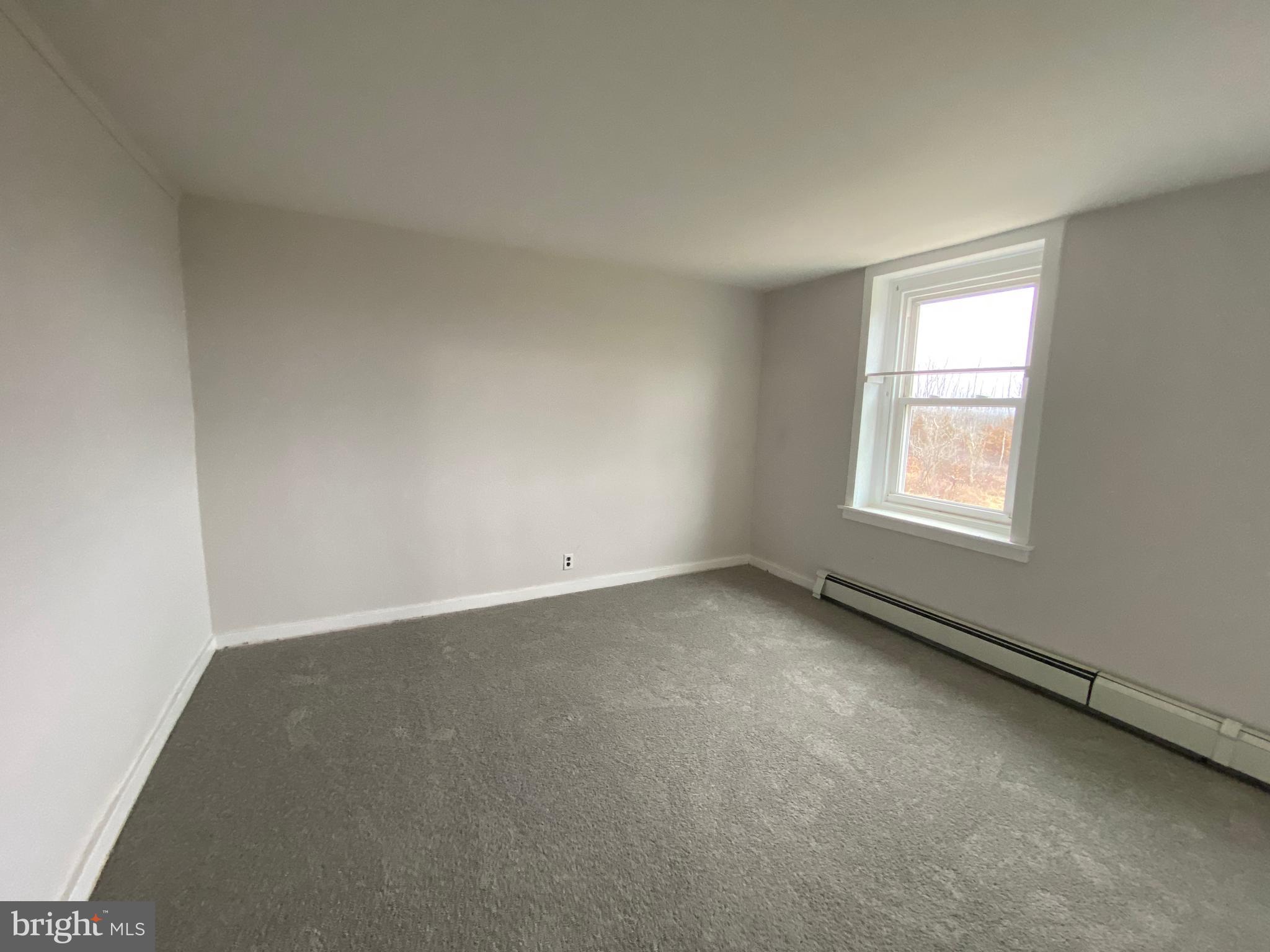 2063 Hill Road, Unit B Perkiomenville, PA 18074 - Photo 13 of 27 an empty room with a window