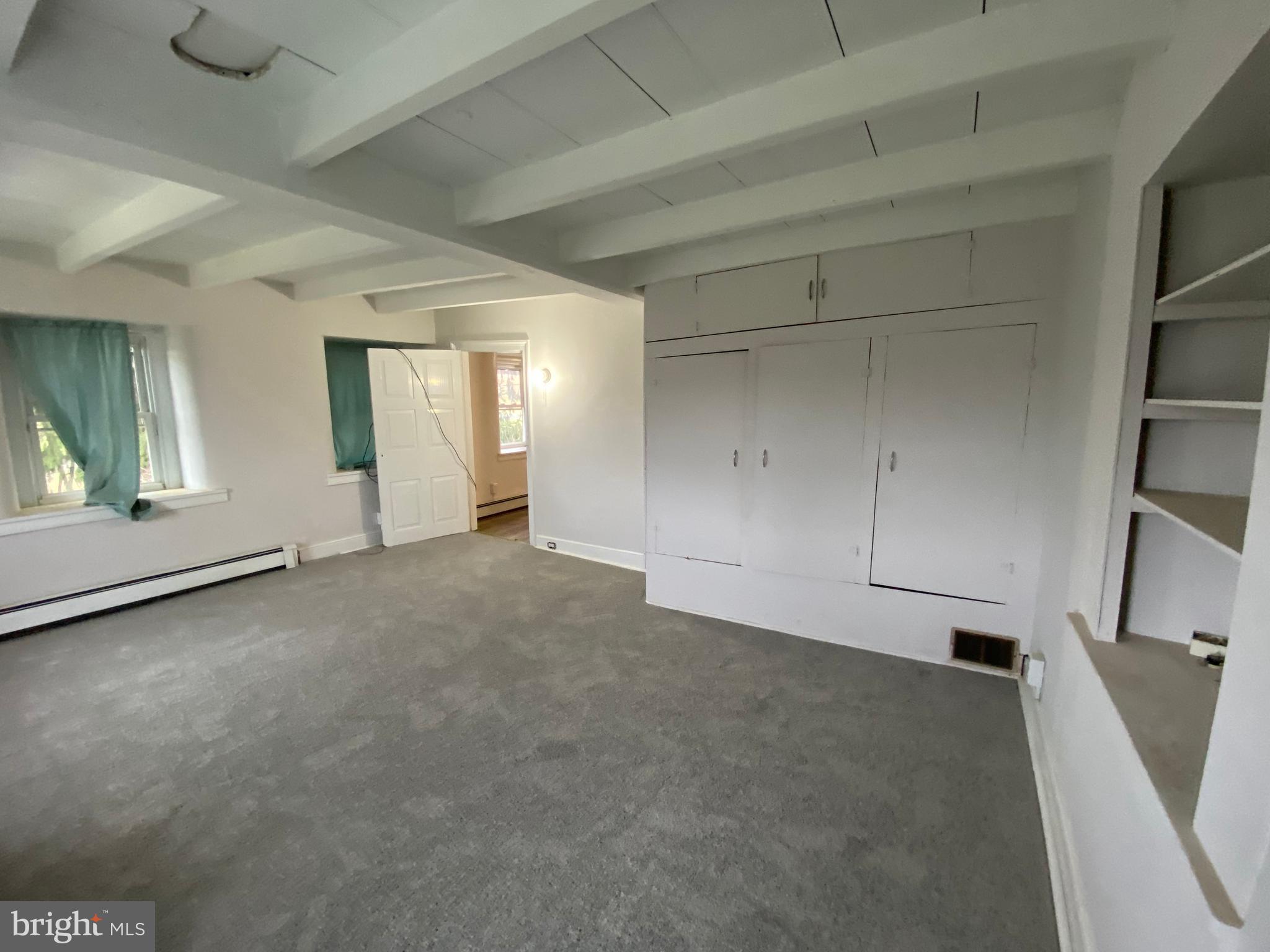 2063 Hill Road, Unit B Perkiomenville, PA 18074 - Photo 20 of 27 a view of an empty room with a window