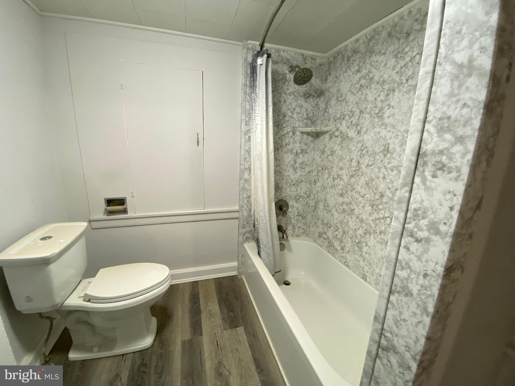 2063 Hill Road, Unit B Perkiomenville, PA 18074 - Photo 25 of 27 a white toilet sitting next to a bath tub