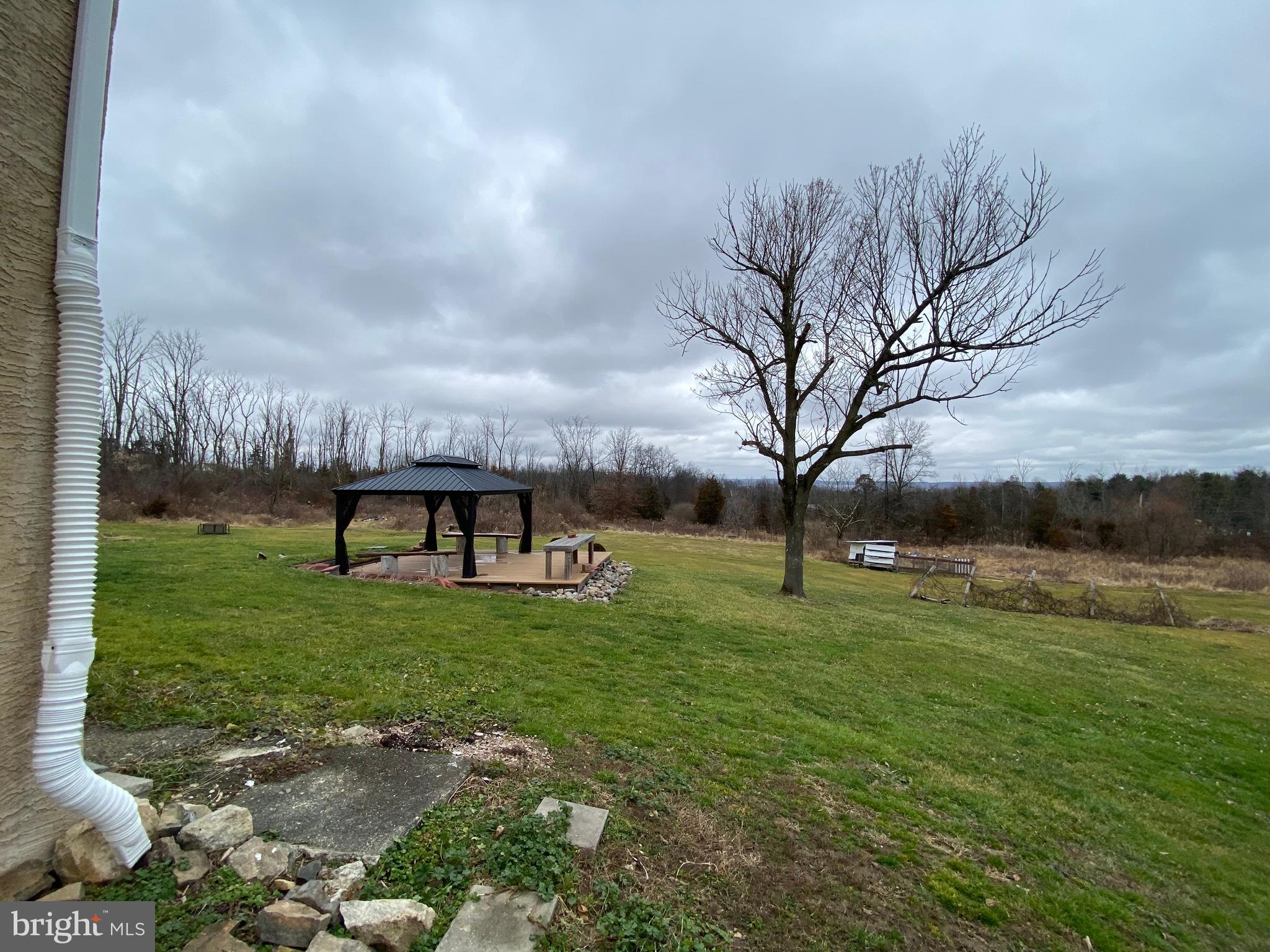 2063 Hill Road, Unit B Perkiomenville, PA 18074 - Photo 27 of 27 a backyard of a house with lots of green space