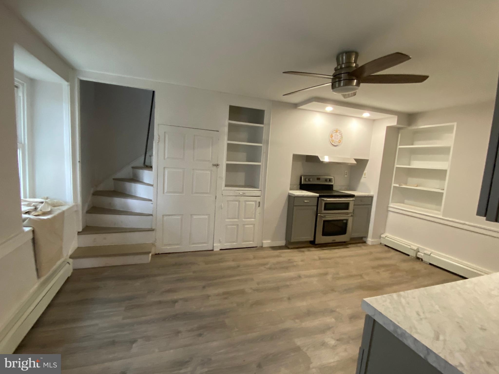 2063 Hill Road, Unit B Perkiomenville, PA 18074 - Photo 3 of 27 a view of a kitchen with furniture and an empty room