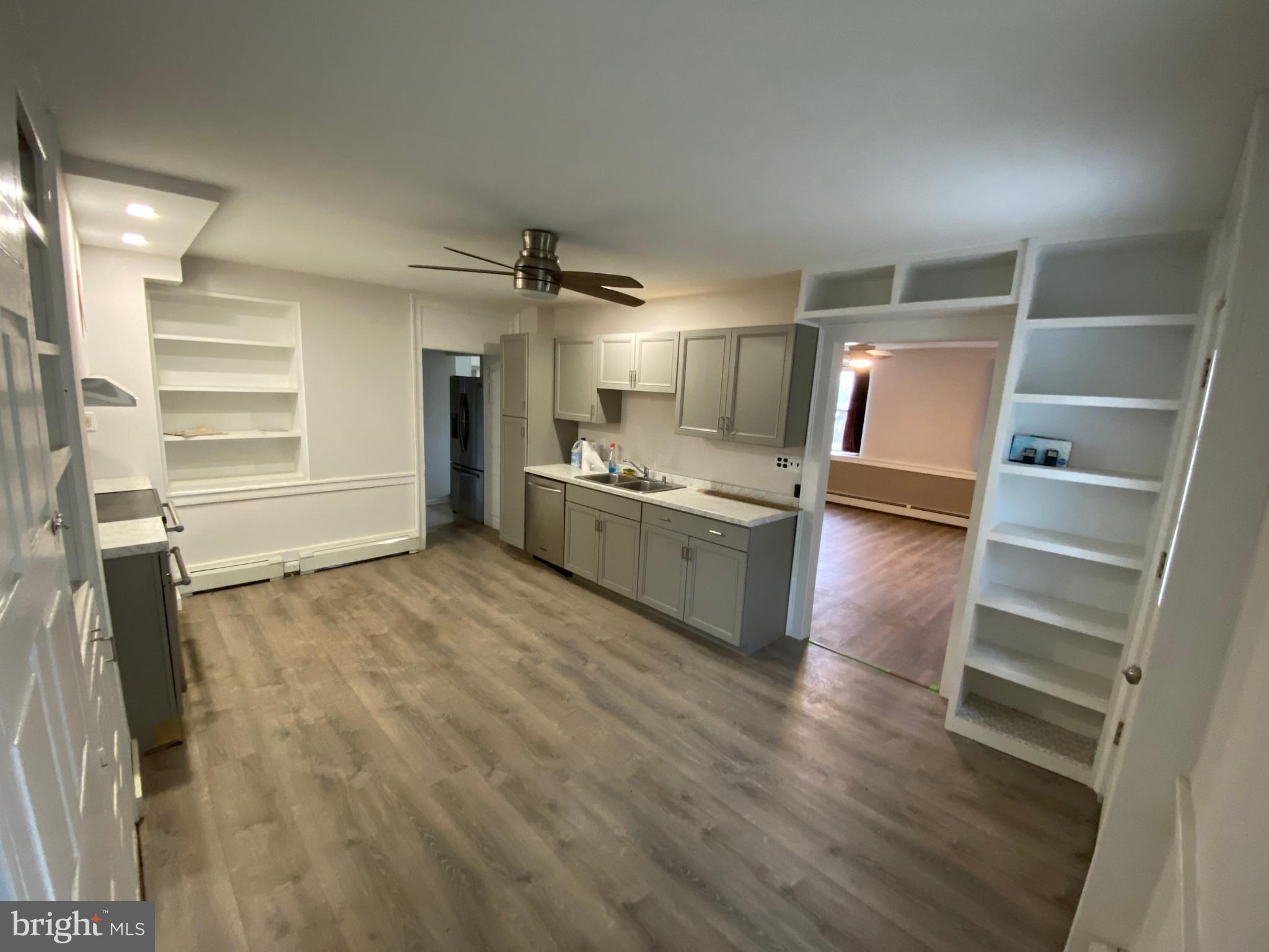 2063 Hill Road, Unit B Perkiomenville, PA 18074 - Photo 4 of 27 a view of a kitchen with wooden floor and electronic appliances