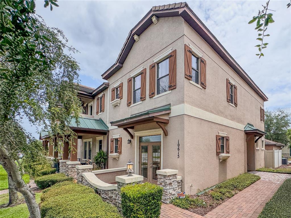 a front view of a house with garden