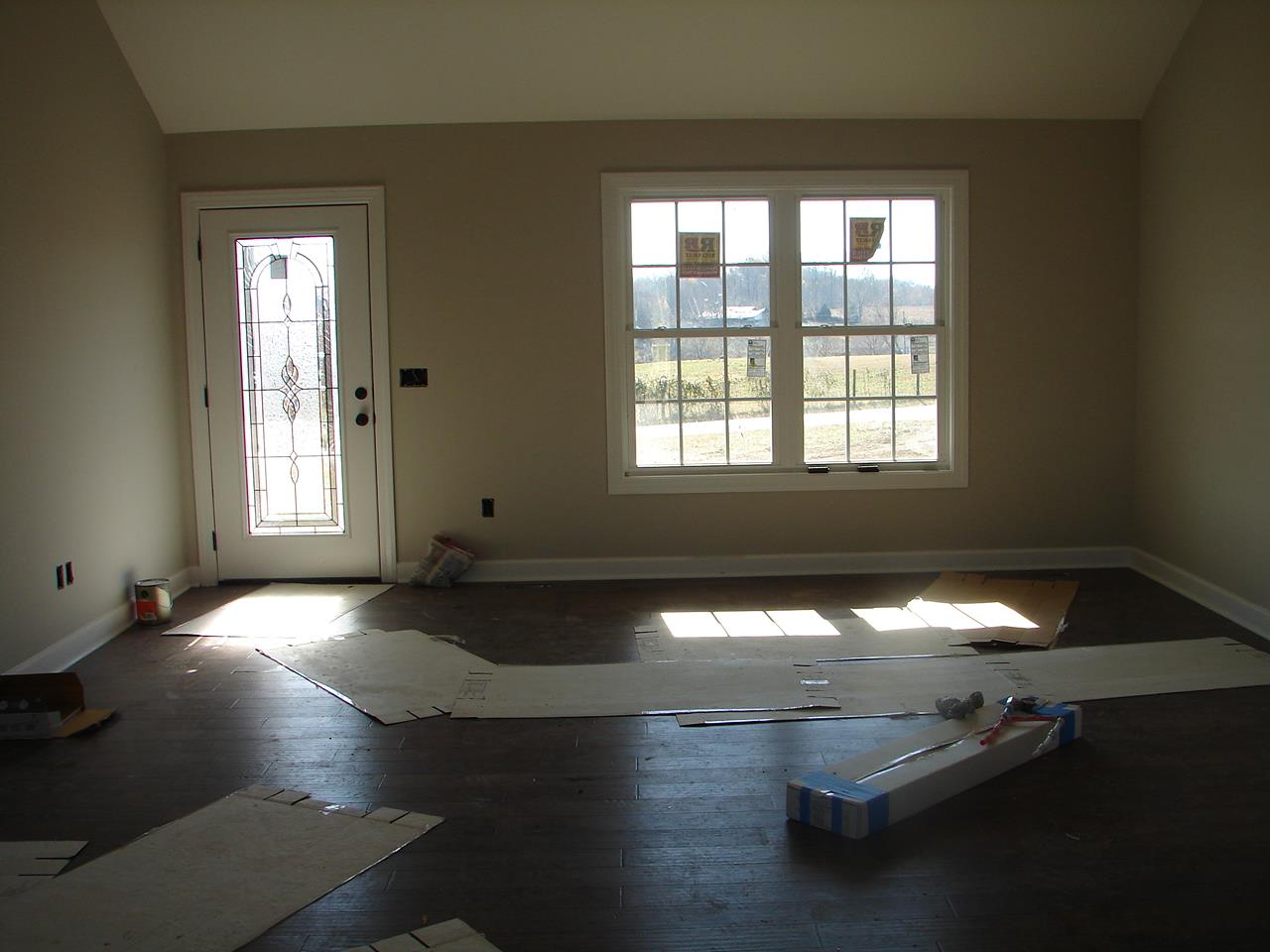593 Womack Road Bethpage, TN 37022 - Photo 3 of 5 a view of an empty room with wooden floor and a window