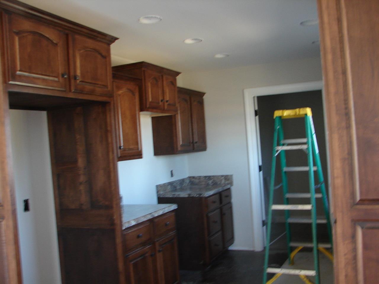 593 Womack Road Bethpage, TN 37022 - Photo 5 of 5 a kitchen with stainless steel appliances granite countertop a refrigerator and a stove top oven