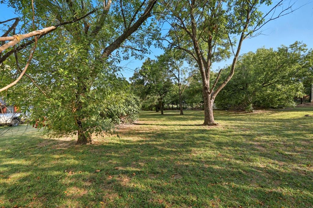 Tbd East 2nd Street Prosper, TX 75078 - Photo 2 of 20 a view of outdoor space with trees all around