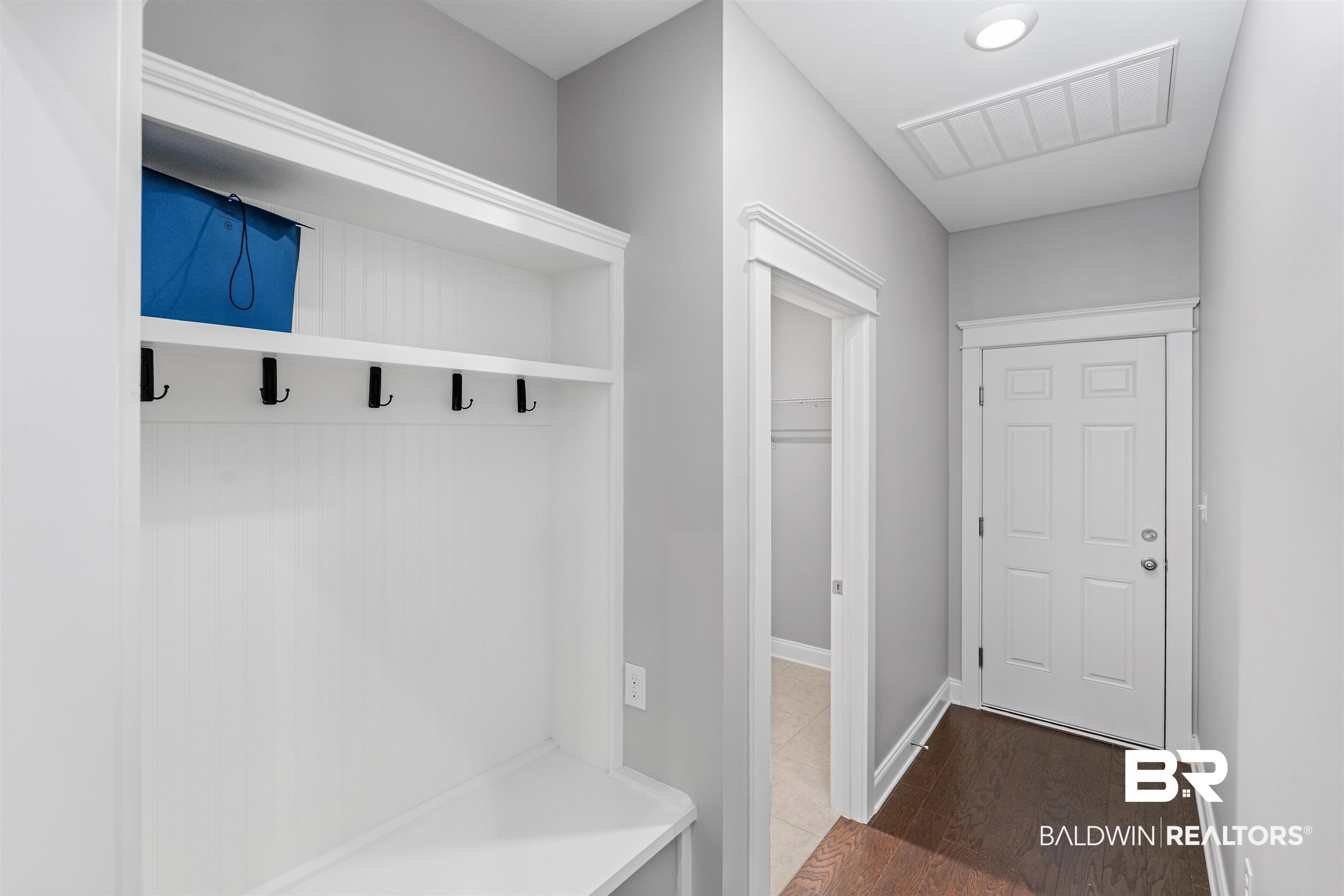 24838 Slater Mill Road Daphne, AL 36526 - Photo 18 of 46 Mudroom with dark wood finished floors and baseboards