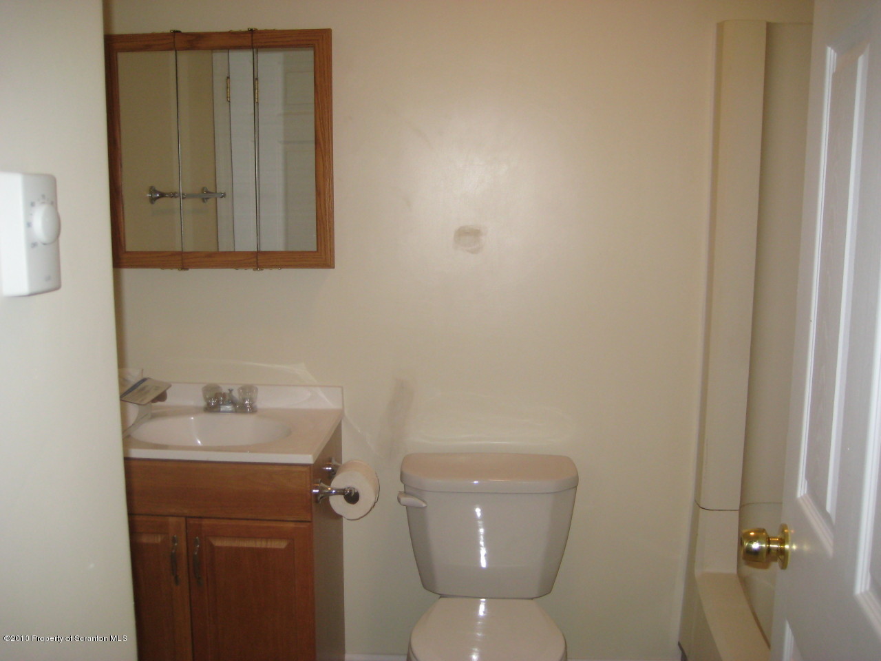 59 John Sheehan Road Mehoopany, PA 18629 - Photo 7 of 9 a bathroom with a toilet sink and mirror