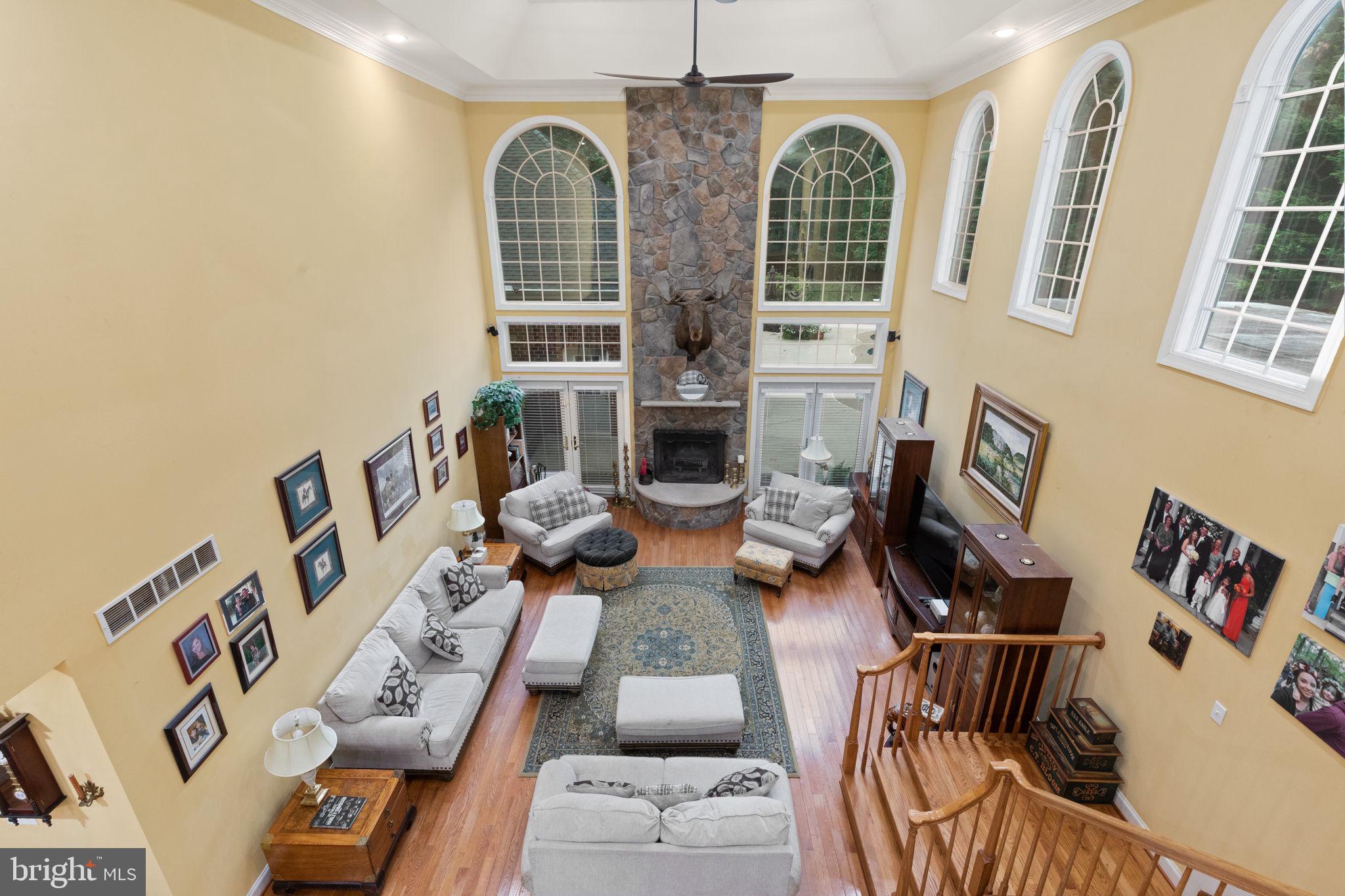 5530 Jim Pickett Road Sykesville, MD 21784 - Photo 15 of 49 a living room with furniture fireplace and wooden floor
