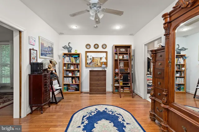 a view of a livingroom with workspace and a window
