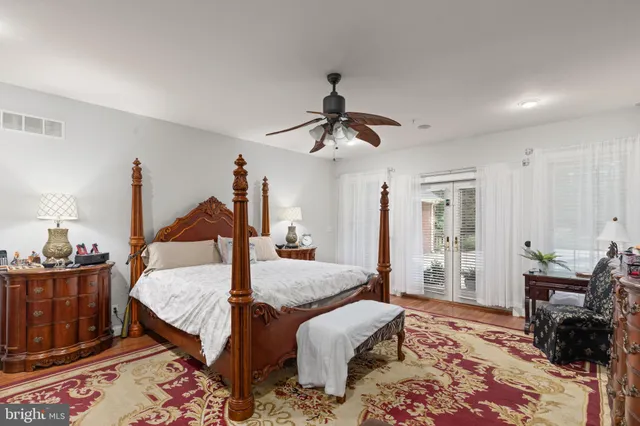 a bed room with furniture and a chandelier