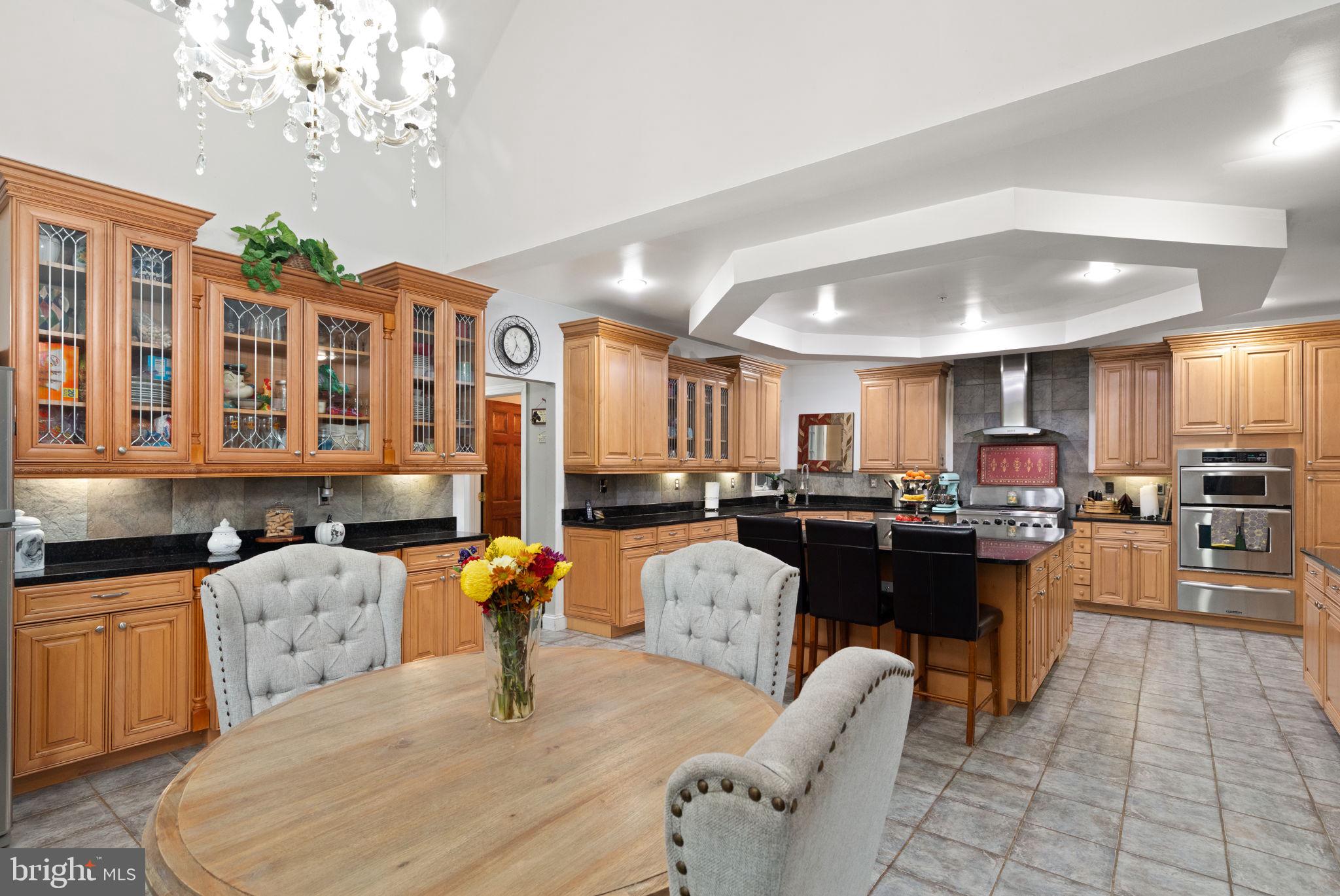5530 Jim Pickett Road Sykesville, MD 21784 - Photo 29 of 49 a large kitchen with a table and chairs