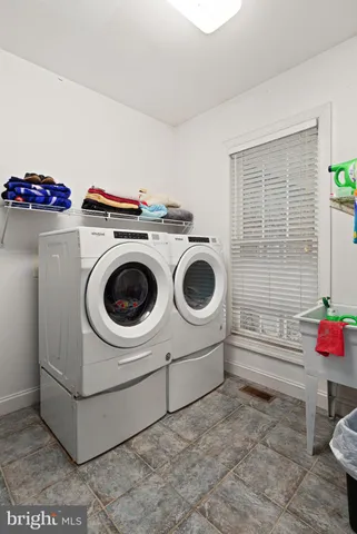 a utility room with dryer and washer