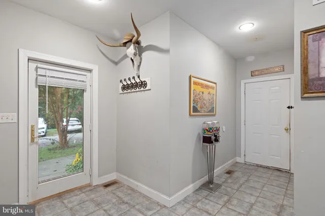 a view of a hallway with a chandelier