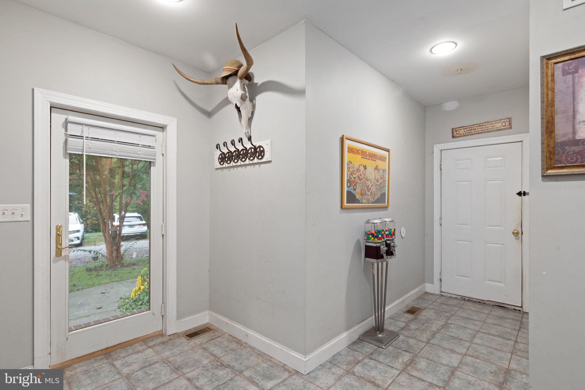 5530 Jim Pickett Road Sykesville, MD 21784 - Photo 33 of 49 a view of a hallway with a chandelier