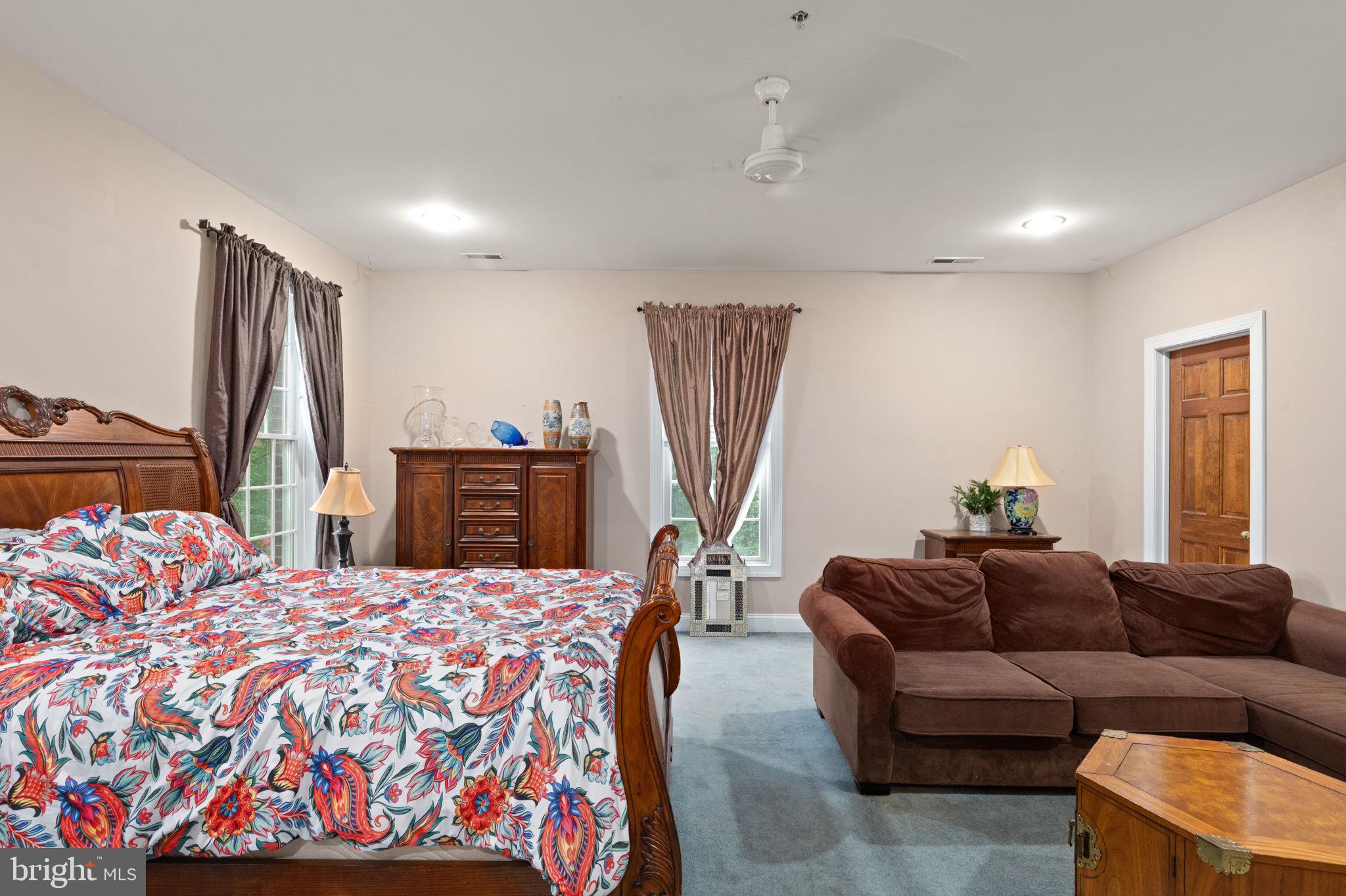 5530 Jim Pickett Road Sykesville, MD 21784 - Photo 34 of 49 a bed room with a bed window and a flat screen tv