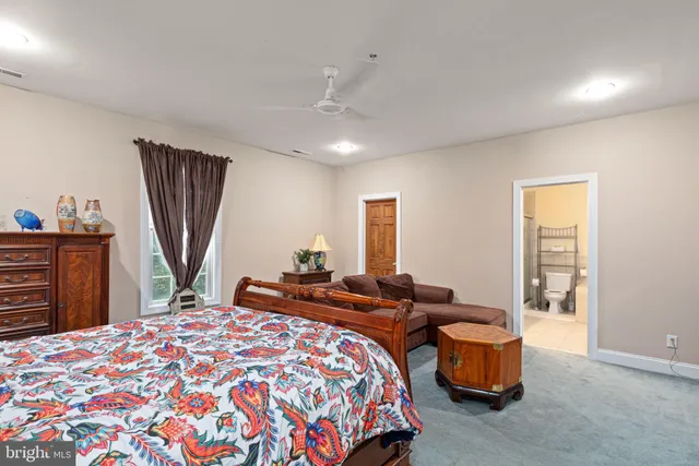 a bedroom with bed and a dresser