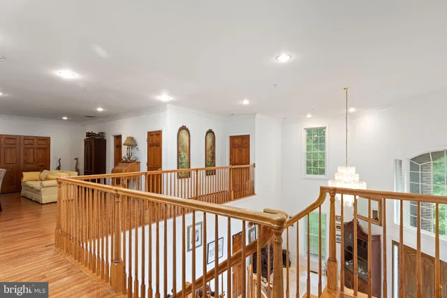 a view of an entryway with wooden floor
