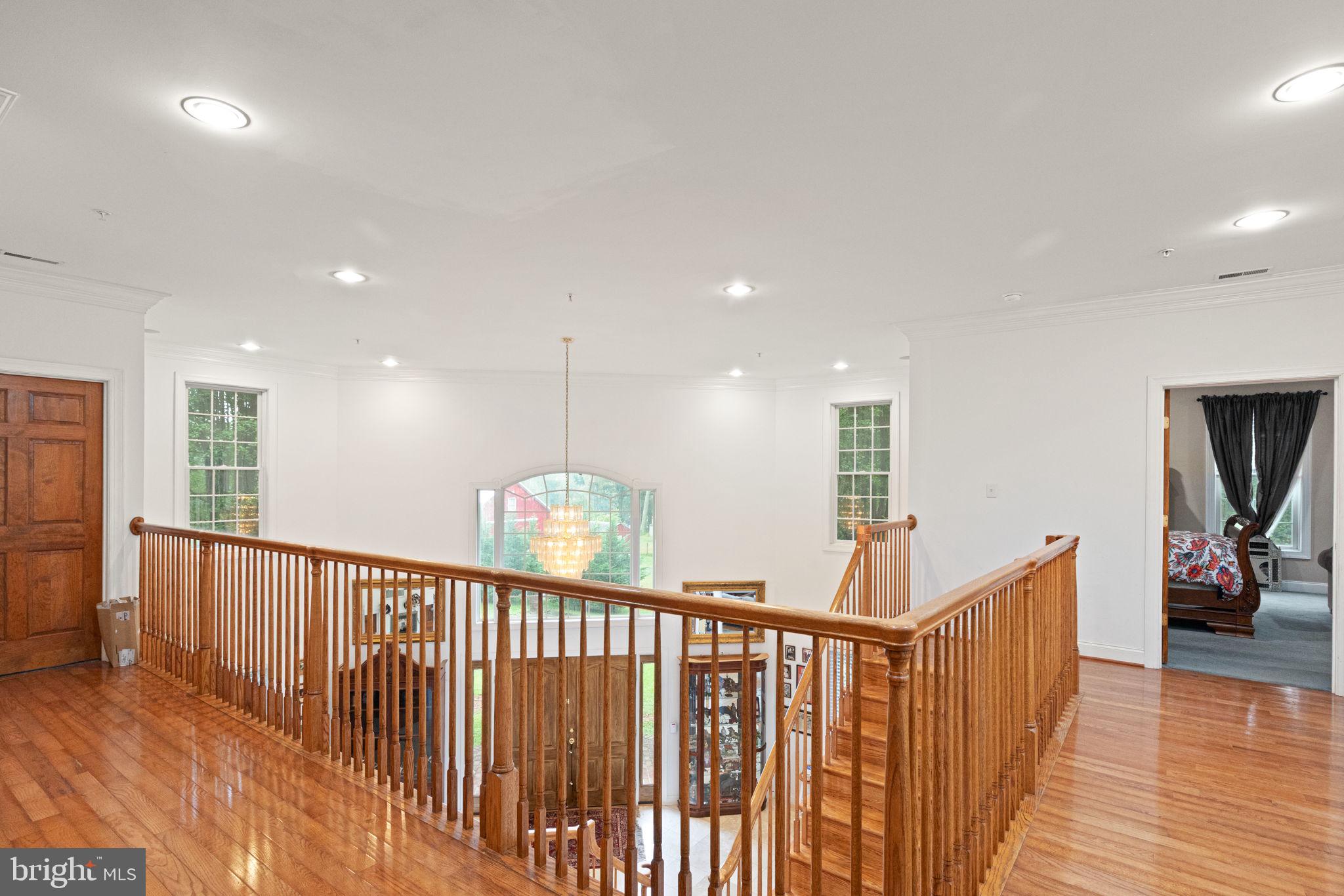 5530 Jim Pickett Road Sykesville, MD 21784 - Photo 40 of 49 a view of a hallway with bedroom and wooden floor