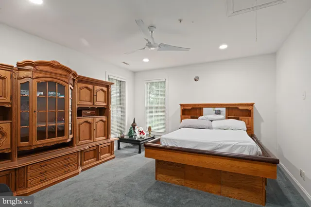 a bedroom with bed and window