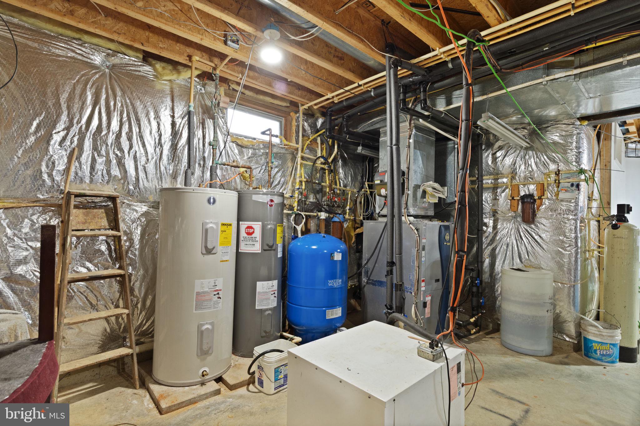 5530 Jim Pickett Road Sykesville, MD 21784 - Photo 45 of 49 a storage room with water heater refrigerator washer and dryer