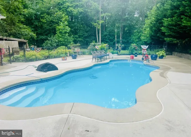 a view of a swimming pool with a patio