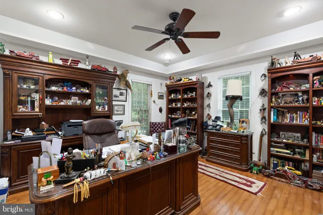 a room with lots of wooden furniture and a rug