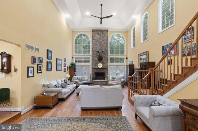 a living room with furniture fireplace and flat screen tv