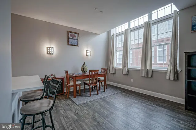 a view of a dining room with furniture and windows