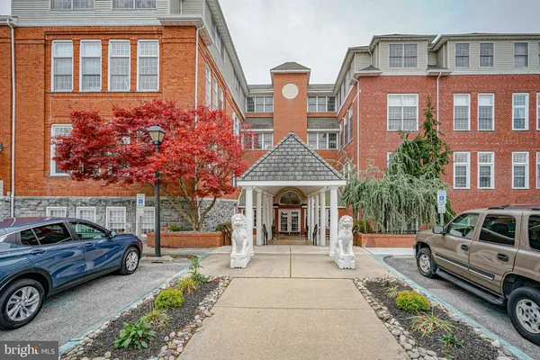a front view of a house with parking area