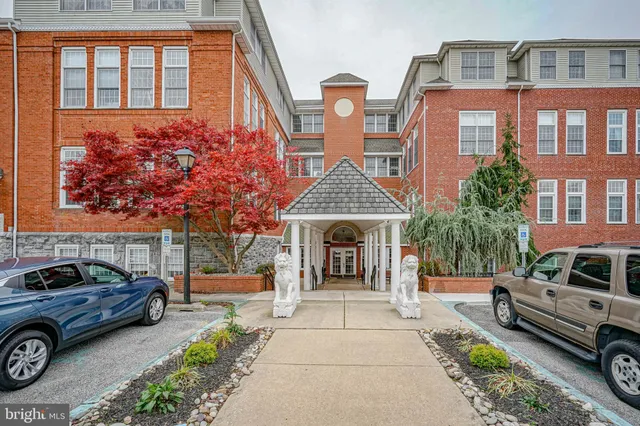 a front view of a house with parking area