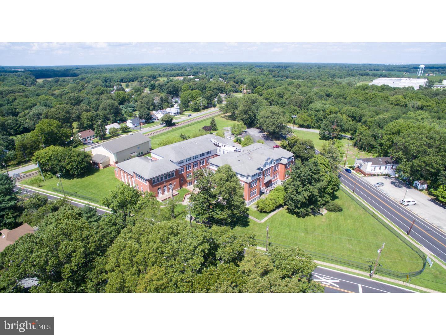 100 Aura Road, Unit 311 Clayton, NJ 08312 - Photo 29 of 29 a view of a city with lush green forest