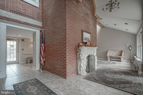 a view of a livingroom with furniture and a fireplace