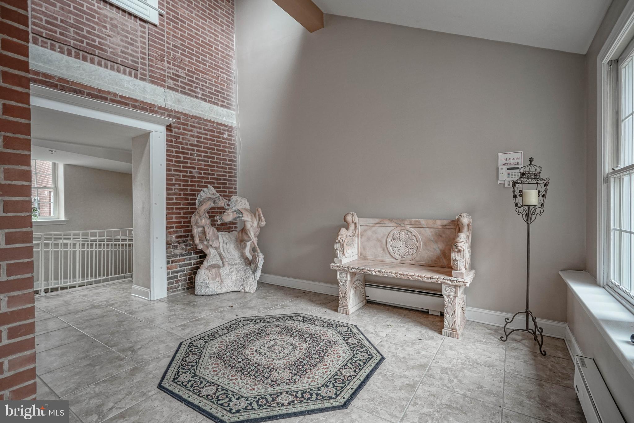 100 Aura Road, Unit 311 Clayton, NJ 08312 - Photo 5 of 29 a living room with furniture and a potted plant